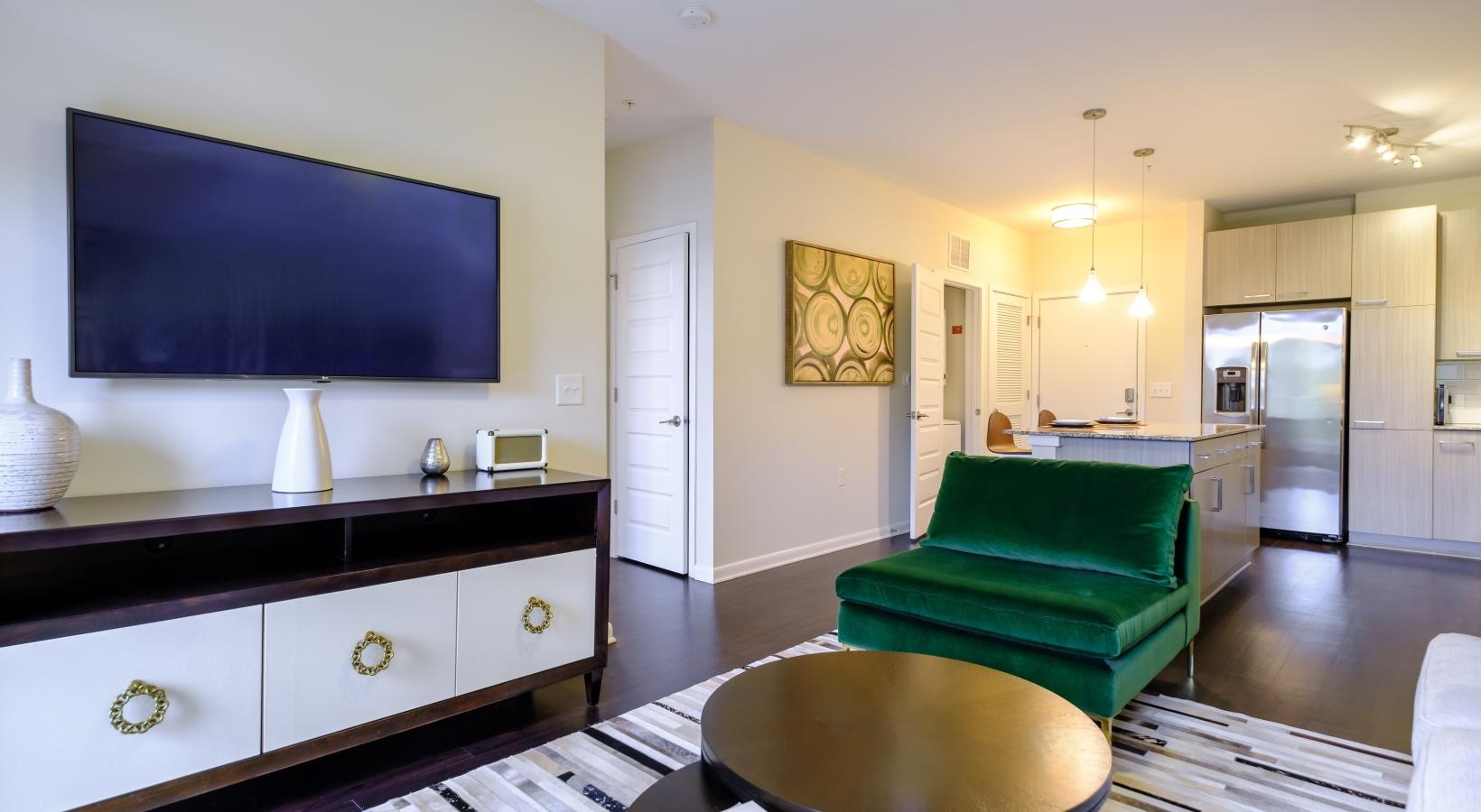 Spacious living areas to recline and recharge a living room with a green couch