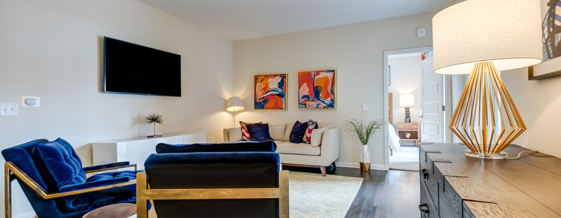 a living room with a table and chairs