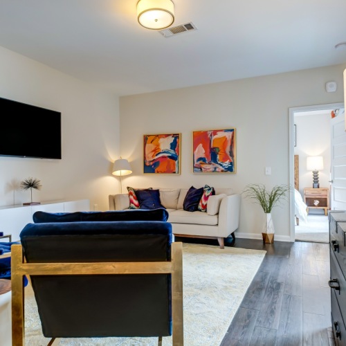 a living room with a table and chairs
