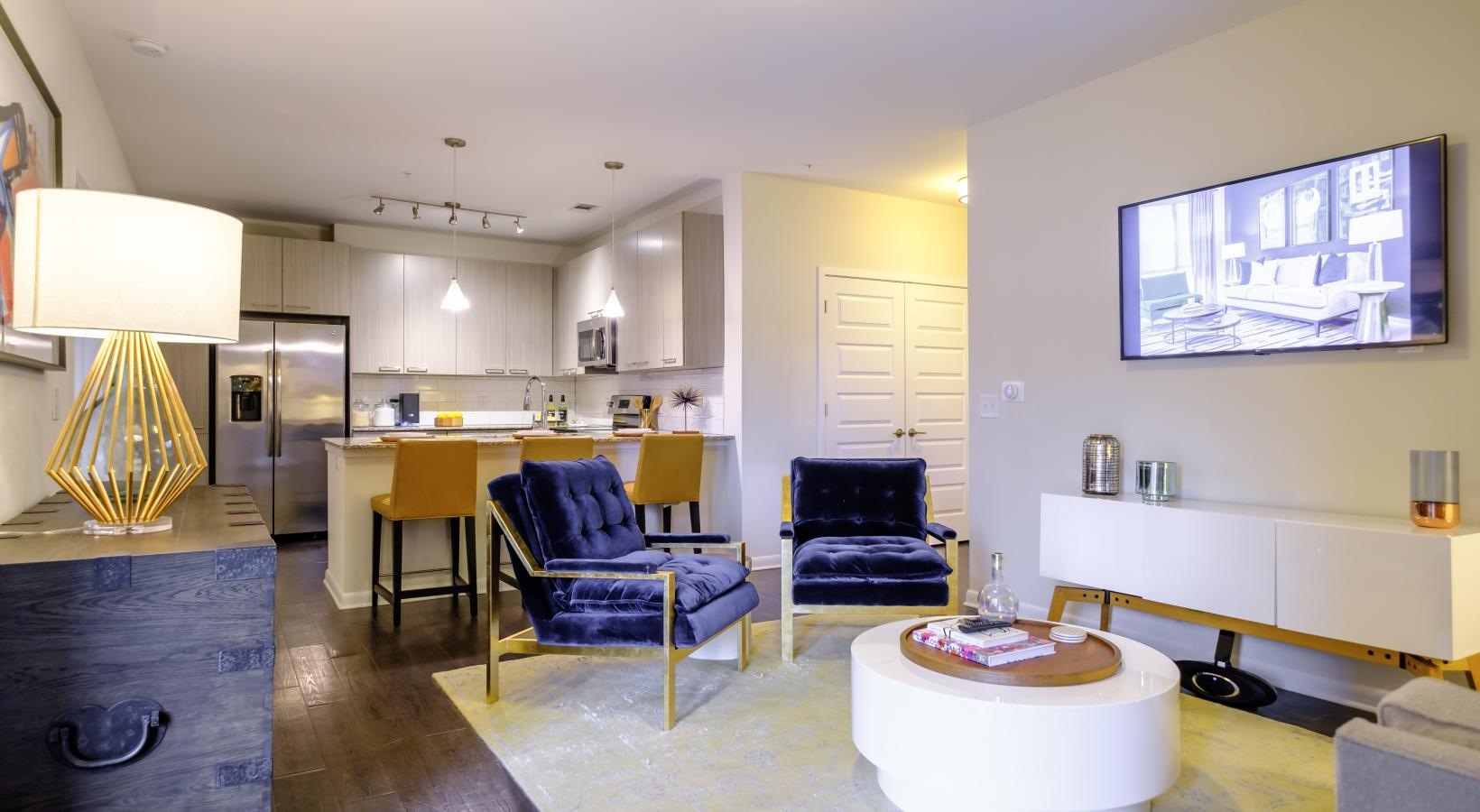 Beautiful living areas to match your lifestyle a living room with a table and chairs