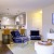 a living room with a table and chairs