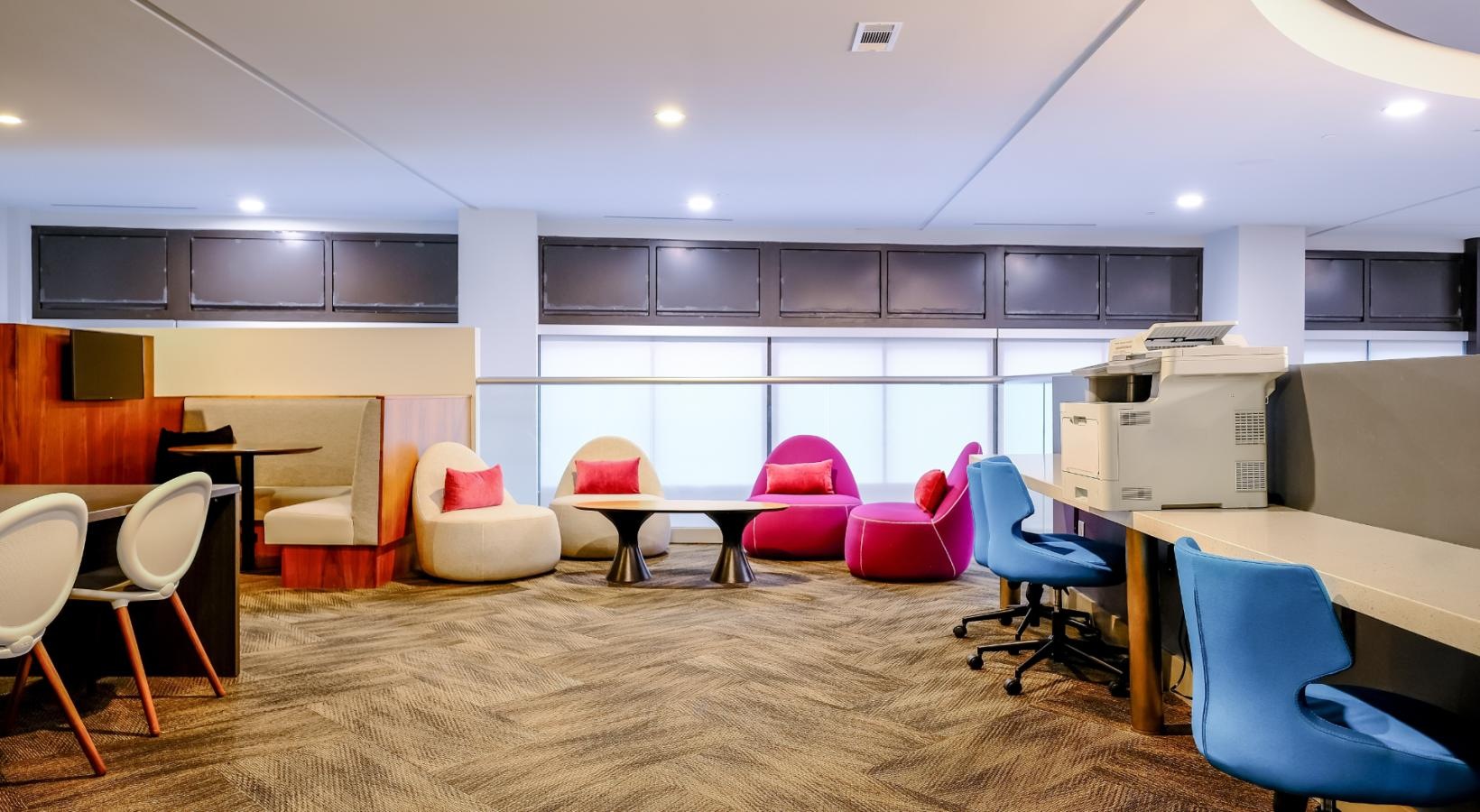 Enjoy our resident-only features a room with chairs and tables