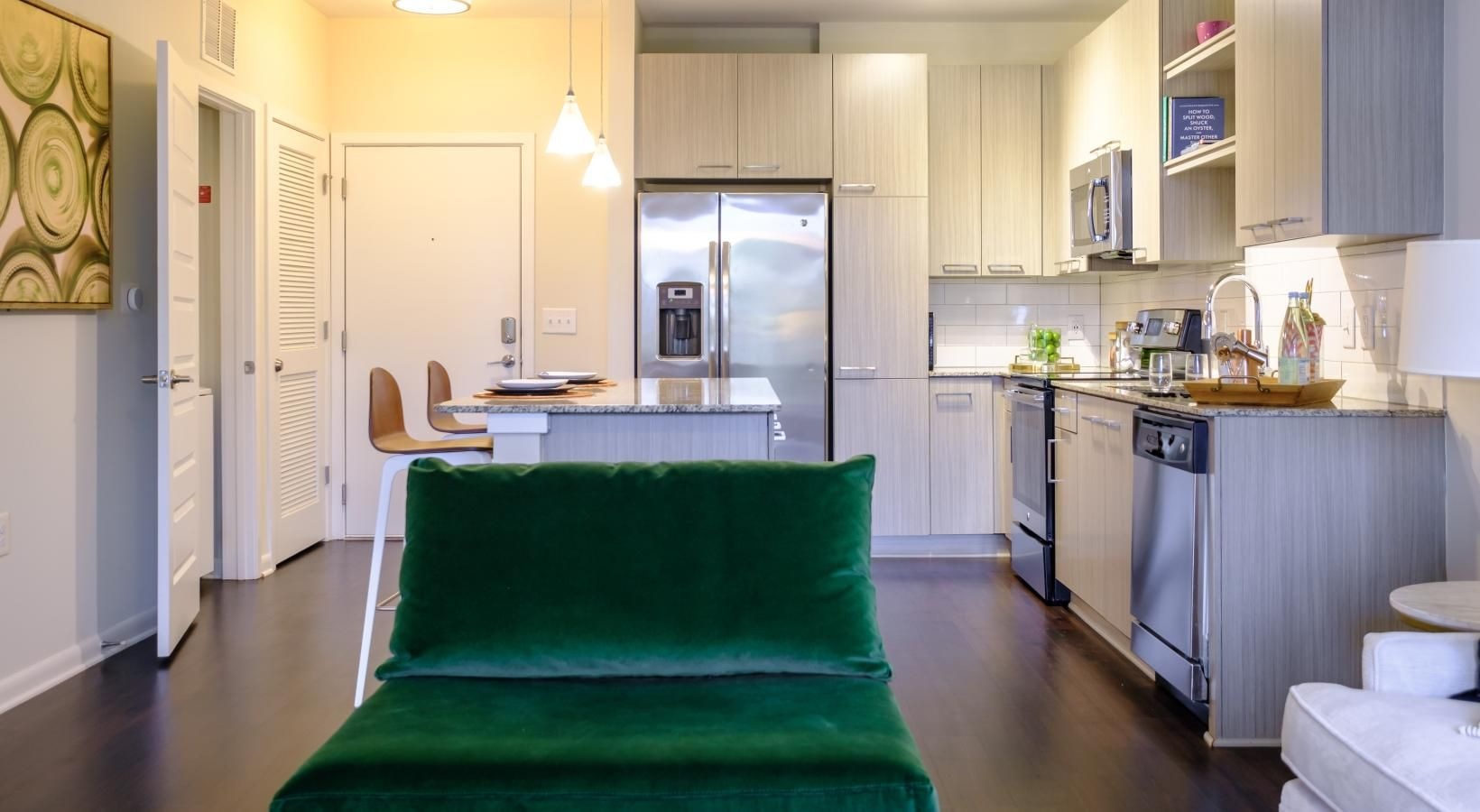 Elegance everywhere you look a living room with a green chair