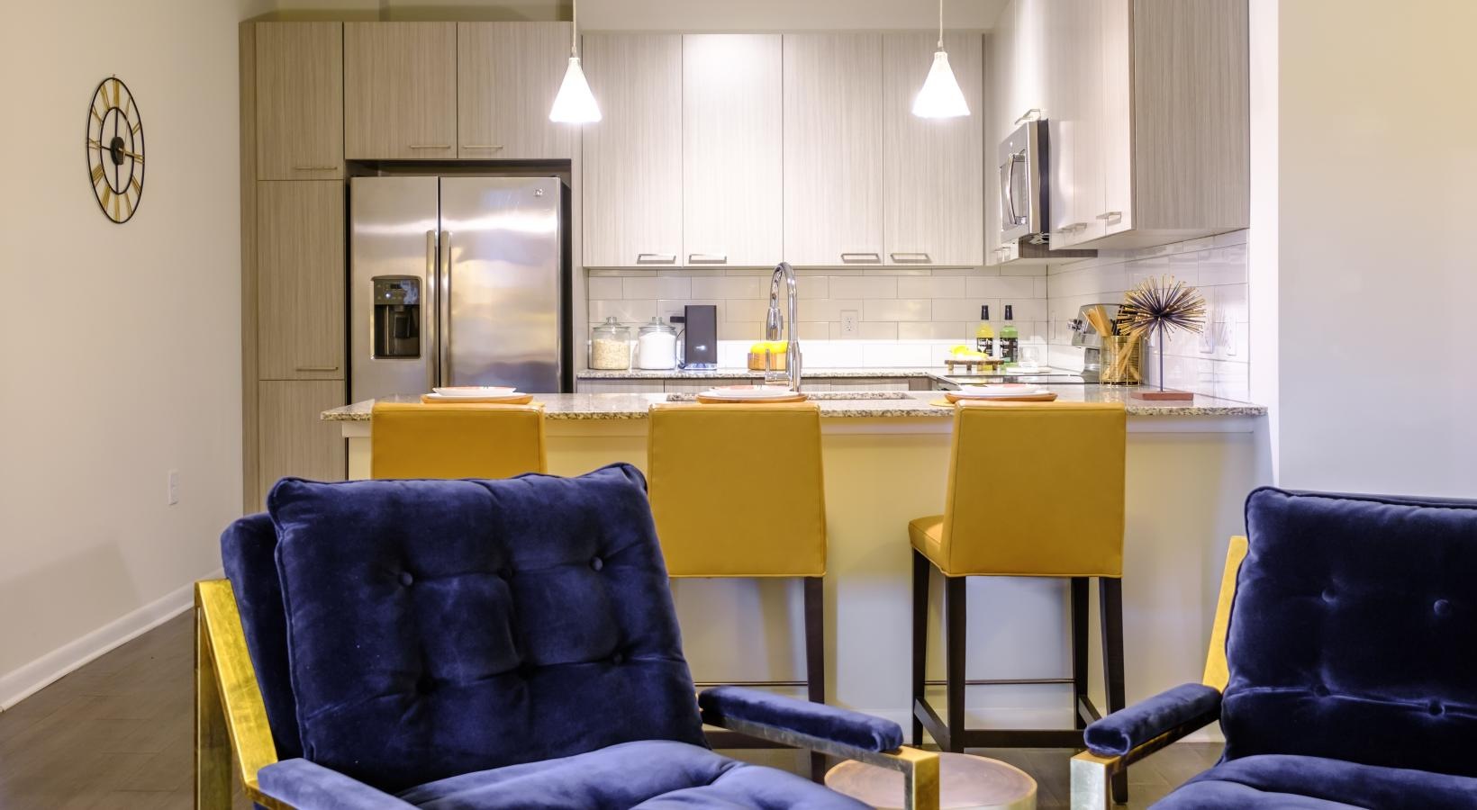 Refined spaces to match your style living area with blue chairs