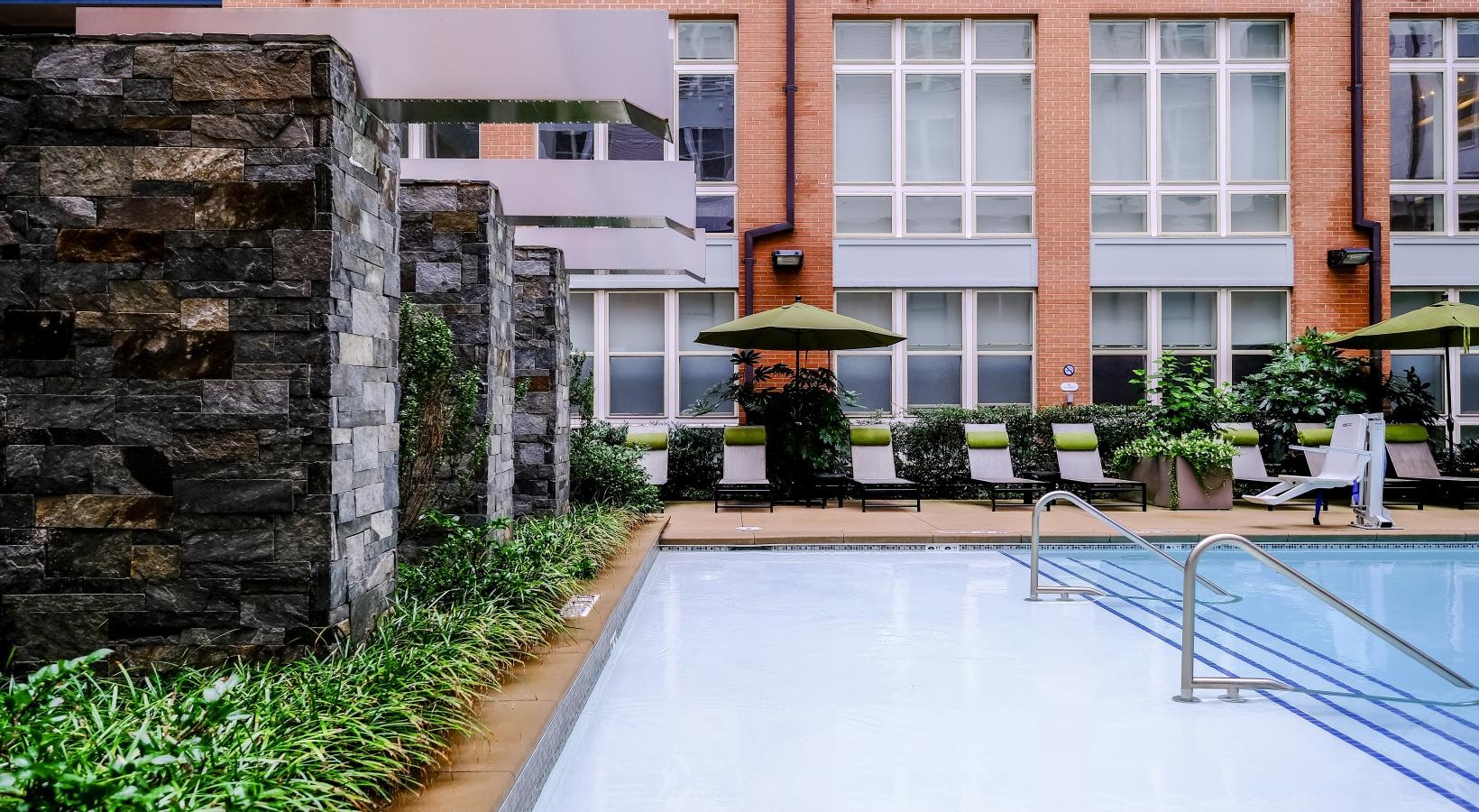 Shimmering resort-style pool a swimming pool outside a building